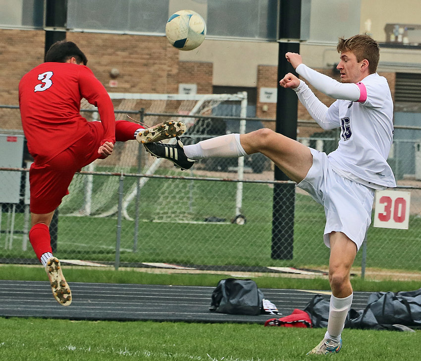 The Cardinals' Riquelme Valdovinos, left, and Blair's Tyler Schroder contend for the ball Wednesday during the Class B Subdistrict 5 Tournament final at South Sioux City.