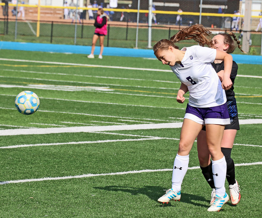 Blair senior Allie Dingfield heads the ball to a teammate Saturday at Bennington High School.
