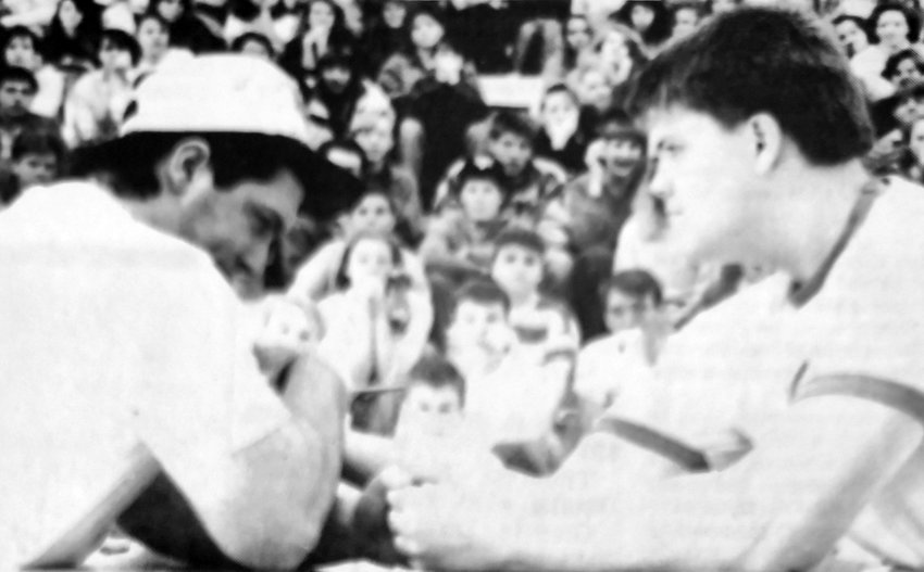 Blair High School freshman Scott Kuhl and senior Don Ryan compete in an arm wrestling match during the 1989 Wilson Cup competition.