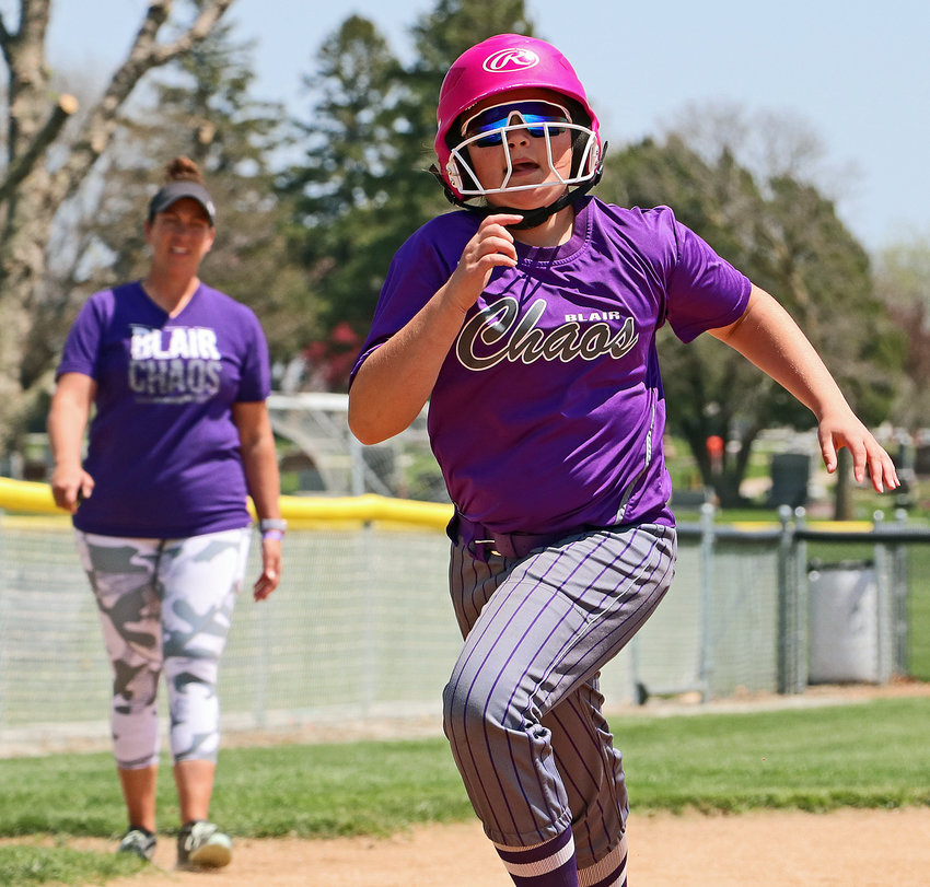 Lauren Wimer of the Blair Chaos 10U softball team races to home plate Saturday at the Youth Sports Complex. The Chaos were playing during the Blair Youth Softball Association May Open, while the Blair Cubs were hosting two of their Bash baseball tournaments across town.