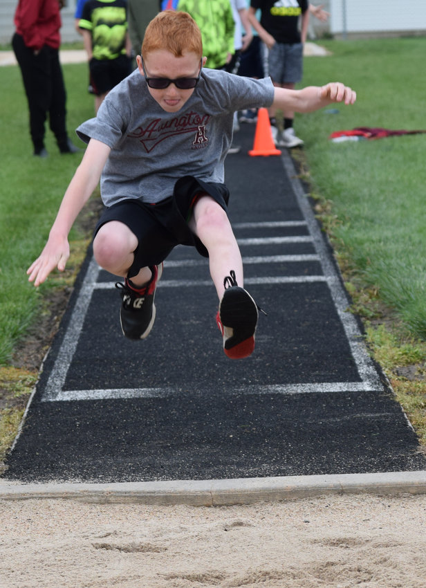 Wesley Koehler competes in the long jump during field day May 13.