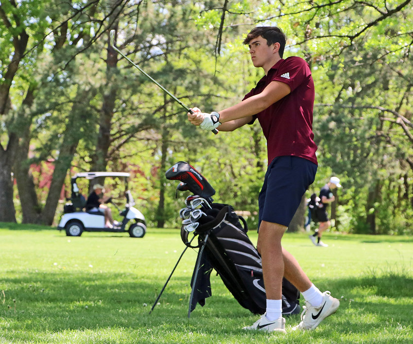 Arlington golfer Josh Hamre watches his shot onto the fairway Monday during the Class C District 2 Tournament at Fremont Golf Club.