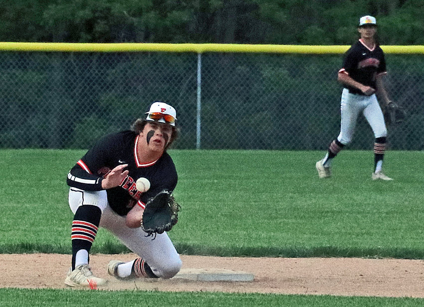 Post 348 second baseman Sam Halford eyes his catcher's throw to second base Friday in Fort Calhoun.