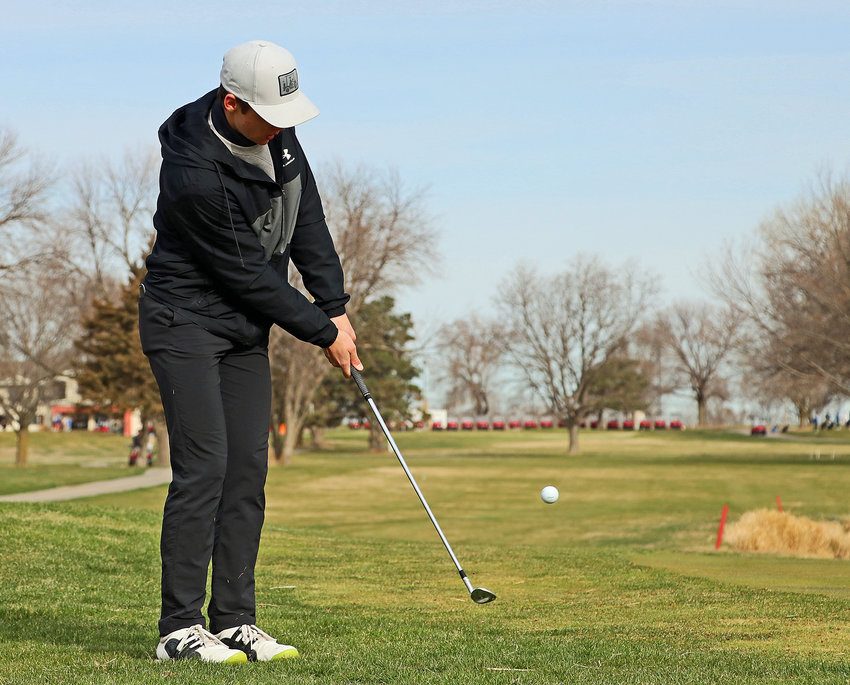 Blair junior Easton Chaffee chips the ball onto the green during an April tournament. On Tuesday, the Bear started state tournament play in Scottsbluff.
