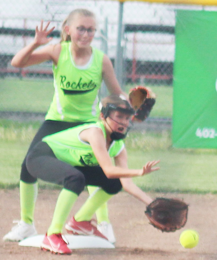 Sabrina Rost (short stop) receives the throw down to  second base on a steal by Wahoo. Raygen Olsen (second base) backs her up.