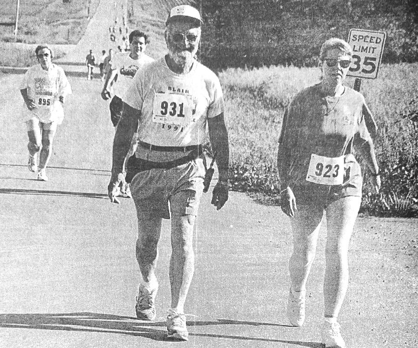 Arvin Hernes, left, and Karla Broman of Blair participate in the 1997 Heart and Sole Run/Walk during Gateway to the West festivities.