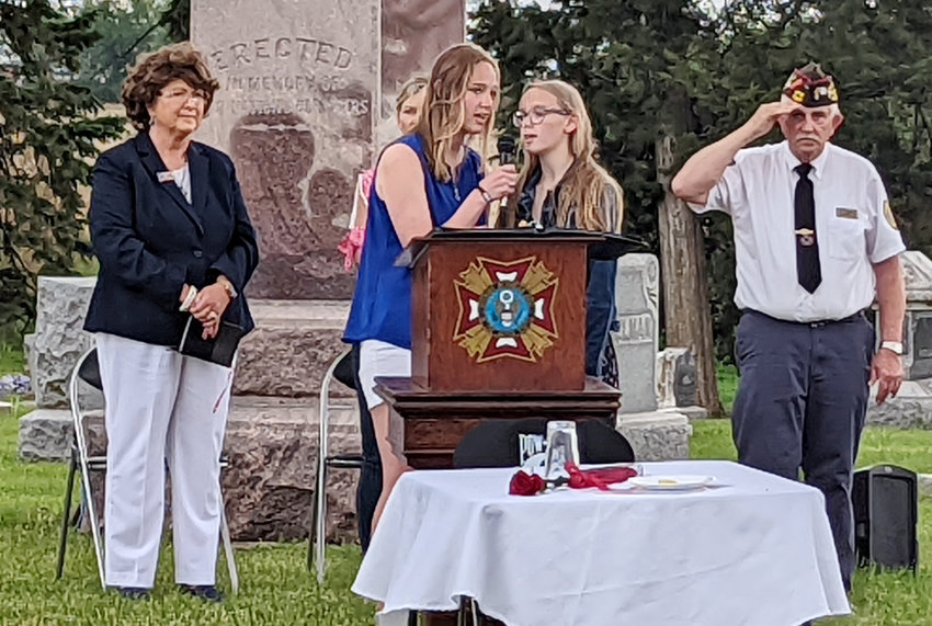 (Left to right) Arianne and Miriel Brokaw honored the fallen service members with a beautiful rendition of the national anthem.