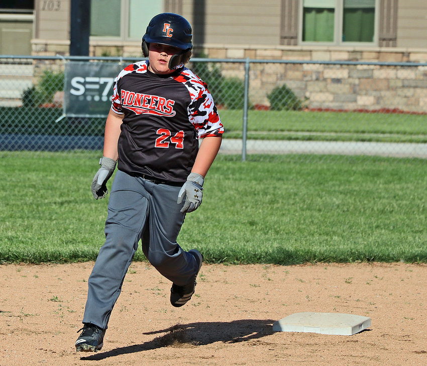 Hunter Colburn of the age 10 and younger Pioneers Black baseball team rounds the bases on his home run trot May 27 in Fort Calhoun. The slugger cleared the centerfield fence with one swing and scored two more runs with another later in the game against an Elkhorn team.