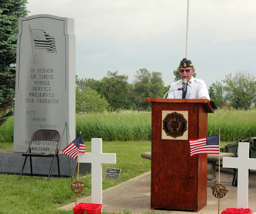 Larry Kusek, commander of Fort Atkinson American Legion Post 348, speaks during the Fort Calhoun Memorial Day service at the Fort Calhoun Cemetery Monday morning.