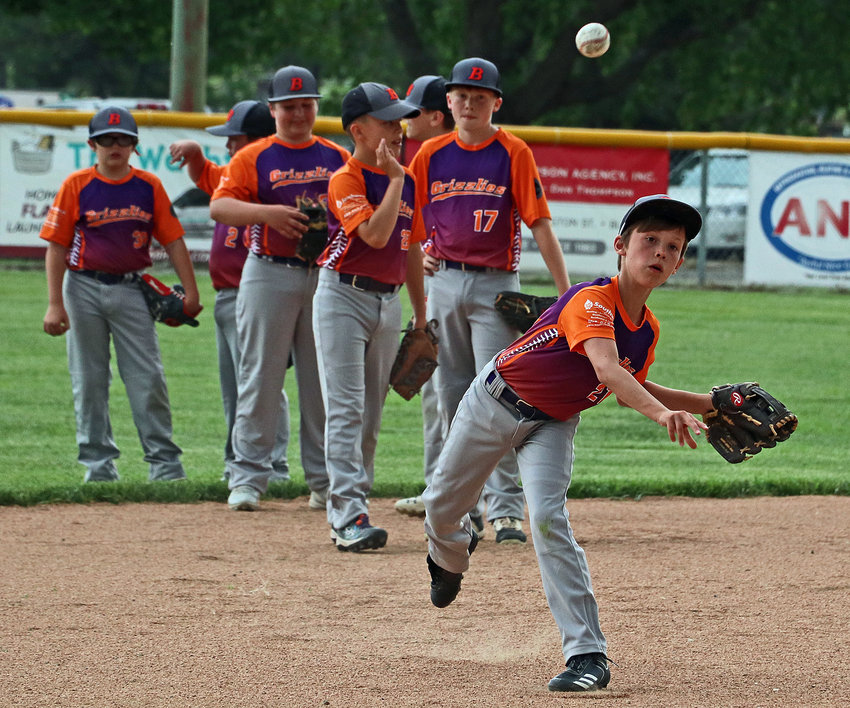 Age 11 and younger Blair Grizzlies ballplayer Brayden Swistak, right, throws to first base during warmups Friday at Wederquist Field. The Grizzlies squared off against the Elkhorn Prime. Their roster includes Swistak, Easton Blair, Drayk Bowen, Trace Stratman, Sean Casey, Donovan Maggio, Quinnton Foulk, Wyatt Smith, Tyce Larsen and Traeton Nitsch.
