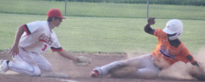 Ross Tremayne puts the tag on at third base.