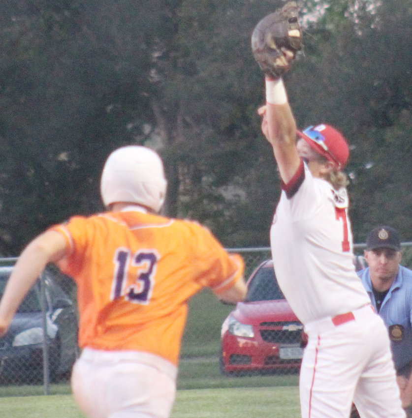 Jake Bruns stretches out to make the catch at first base for the out.
