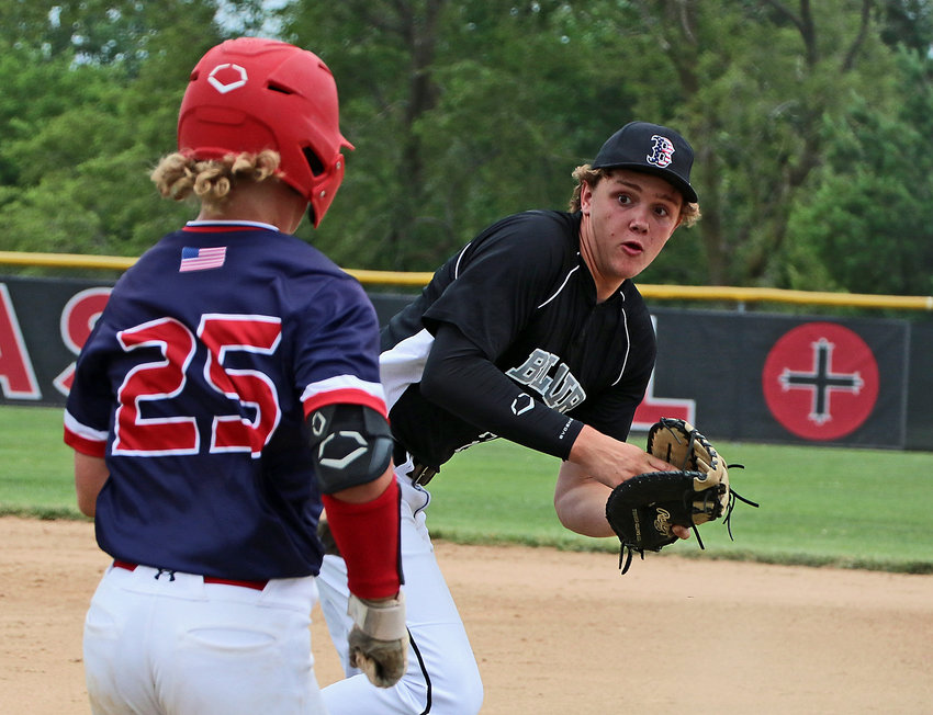 With the ball in his glove, Blair Junior Legion first baseman Thomas Chikos, right, races a Hickman base runner to the bag June 30 at Elkhorn Mount Michael. The Post 154 Bears lost the ENBL Tournament game, 4-1.