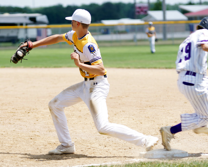Hooper/Scribner&rsquo;s Owen Meyer makes the catch at first base for the out in the district baseball game against Battle Creek.