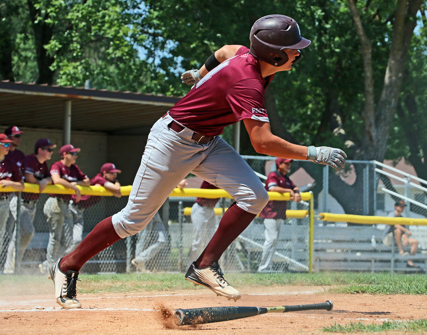 Arlington batter Kaden Pittman takes off toward first base after making contact Friday against Springfield at Vets Field.