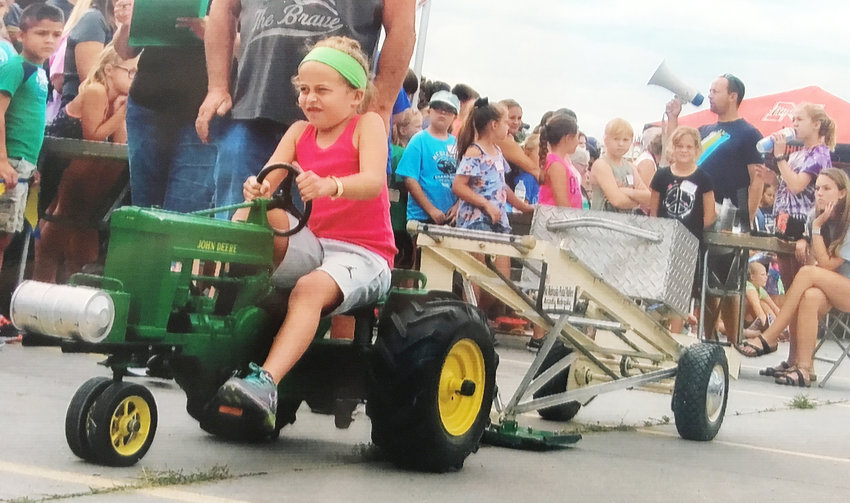 It has been a few years since Kaydence Voyles&rsquo; face told the story as she struggled to keep the sled moving at the Pedal Pullers Tractor Pull at the Nebraska State Fair.  The fun continues as Uehling is set to host a Kiddy Tractor Pull on Sun., Sept. 4th at 4:30 p.m. west of the auditorium.  Everyone is invited to join the fun.