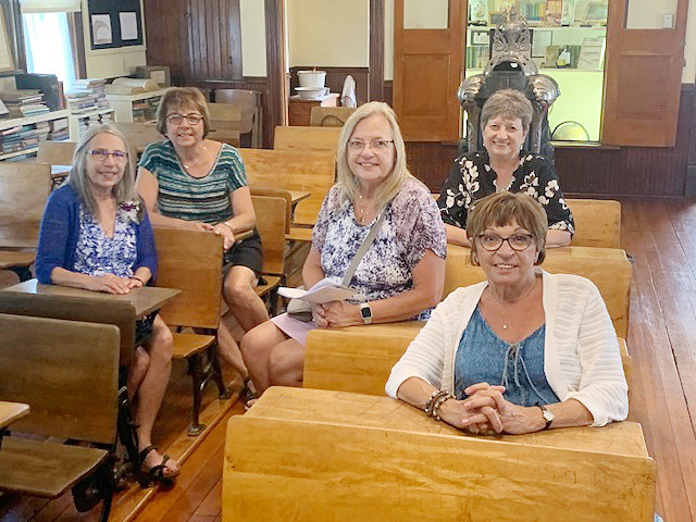 Five sisters met for lunch in Tekamah on Thursday, July 28, and spent the afternoon at Burt County Museum. Seated in the museum&rsquo;s schoolhouse, from left, are Teresa Birkel of Dwight, Karen Hillen of Leigh,&nbsp; Sue Kunert of Glenwood, Iowa, Diane VanDerslice of Dwight; and, front, Jackie Witzel of Crete.