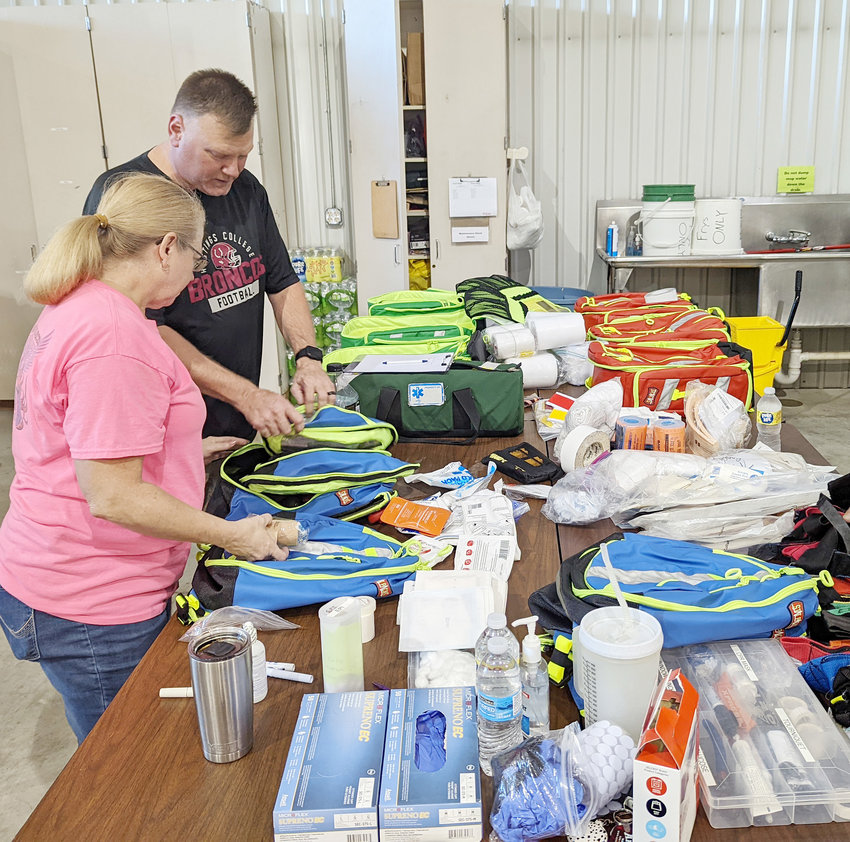 Scott Burgett and Rescue Captain Karolyn McElroy discuss what the best way is to set up the new bag system. Having what you need when you need it could save lives.