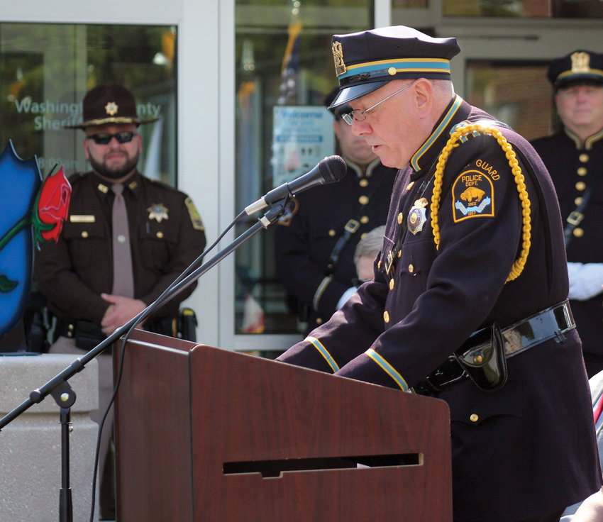 Fort Calhoun Mayor and former OPD police sergeant Mitch Robinson presents a tribute for City Marshal Albert Suverkrubbe of the Fort Calhoun Police Department during the 2021 National Peace Officers Memorial Day. Robinson retired from OPD after a 30-year law enforcement career.