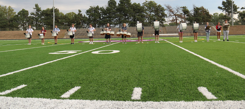 The Blair High School marching band drum line marches off the new Krantz Field turf ahead of its first performance Friday night.