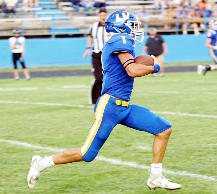 Raider Quarterback Justus Weidemann #1 has running room as he sprints for a gain on the play against the Ponca Indians.  Justus finished the night with 9 carries for 78 rushing yards.