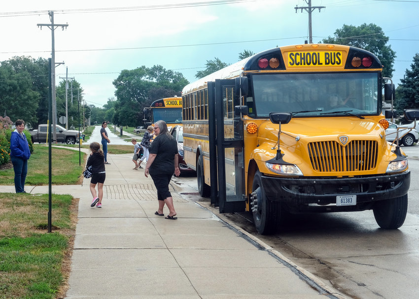 School buses drop off students at South Primary School Friday morning.