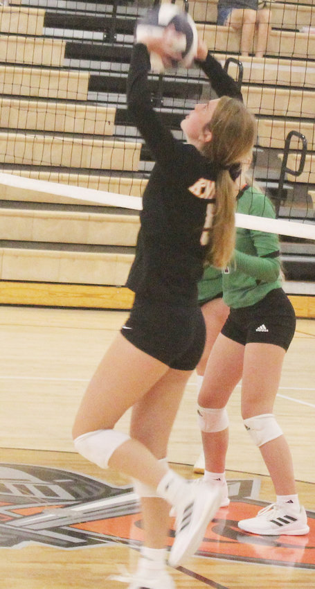 Mia Thomsen sets the ball for an O-C hitter.