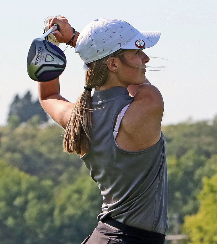 Blair's Quinn Thompson follows through on her tee shot Thursday at River Wilds Golf Club.
