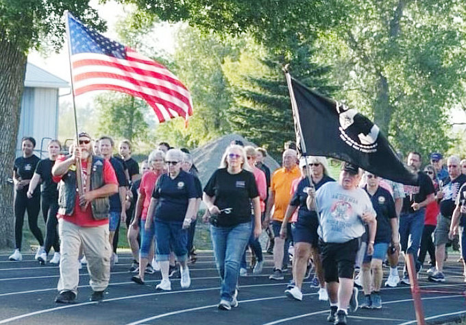 Jeff West leads the pack presenting the American flag. Burt County Veteran Services Officer Penny Warren and Bob Hawkins presented the POW/MIA flag during the silent lap in Oakland on Sept. 16th.