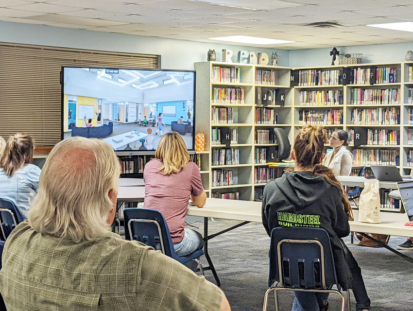 The LDNE Board of Education watch on as  Hannah Schafers shows a virtual video of what the new LDNE school will look like now that choices have been made..