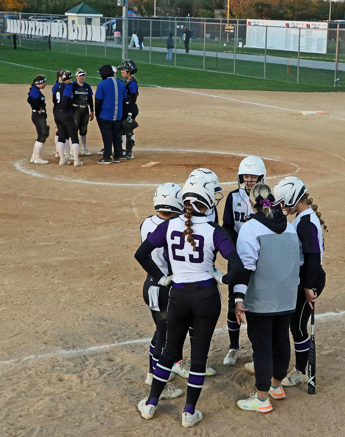 The Blair Bears huddle Wednesday against Bennington at the Bill Smith Softball Complex in Hastings.