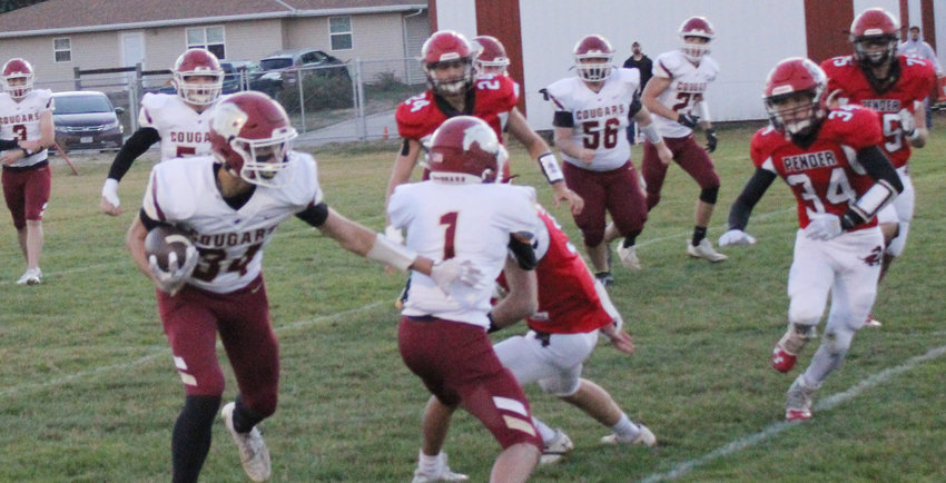 Kaden  Knaak makes yards after a catch with the help of of block from Braden Hardin.