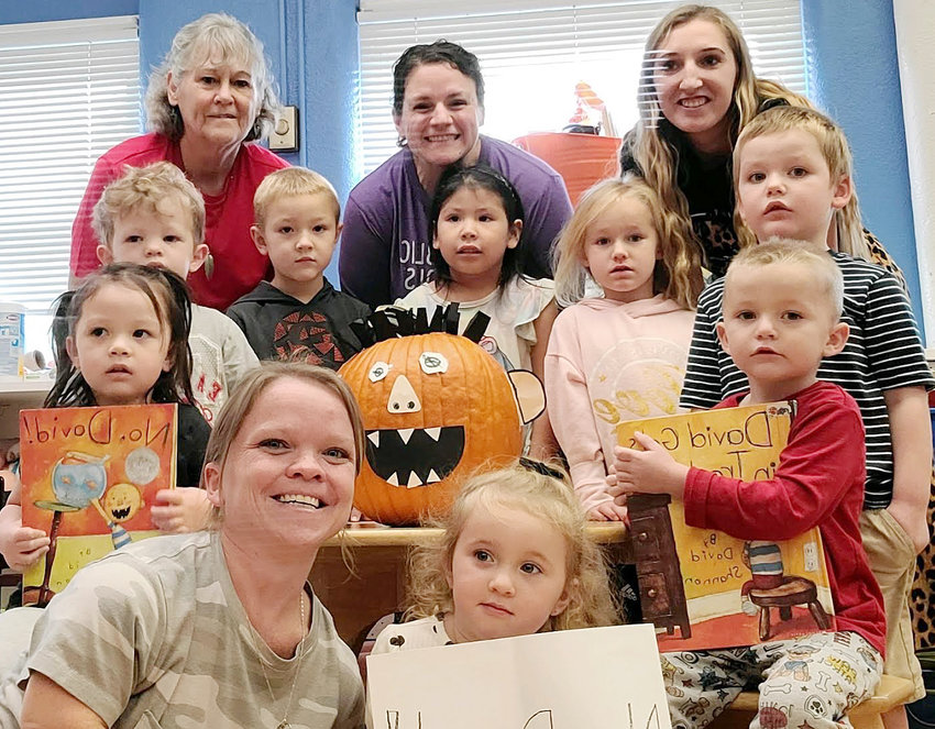 Miss Sarah's Preschool class is happy to take a picture with their new friend David. Starting with the one on the left holding the No David Book and going around Clockwise: Lara, Dawson, Miss Jo, Hazzin, Miss Sarah, Katarina, Madison, Mrs. P, River, Kenji, Anzleigh, Miss Ruthie