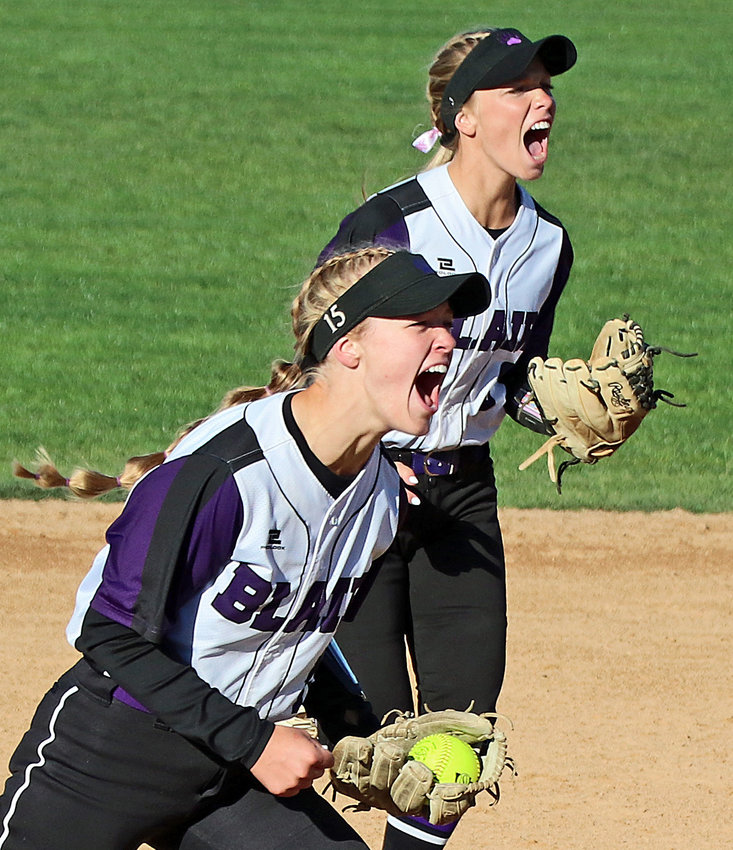 Blair's Nessa McMillen, left, and Leah Chance celebrate an out Wednesday in Hastings.