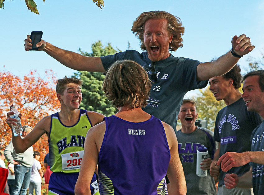 Blair cross-country coach Carson Norine, middle, reacts to the Bears' third-place state finish with Ted Lueders, from left, Calin O'Grady, Tannon Bellemy, Nolan Slominski and assistant coach Kadan English on Friday at Kearney Country Club.
