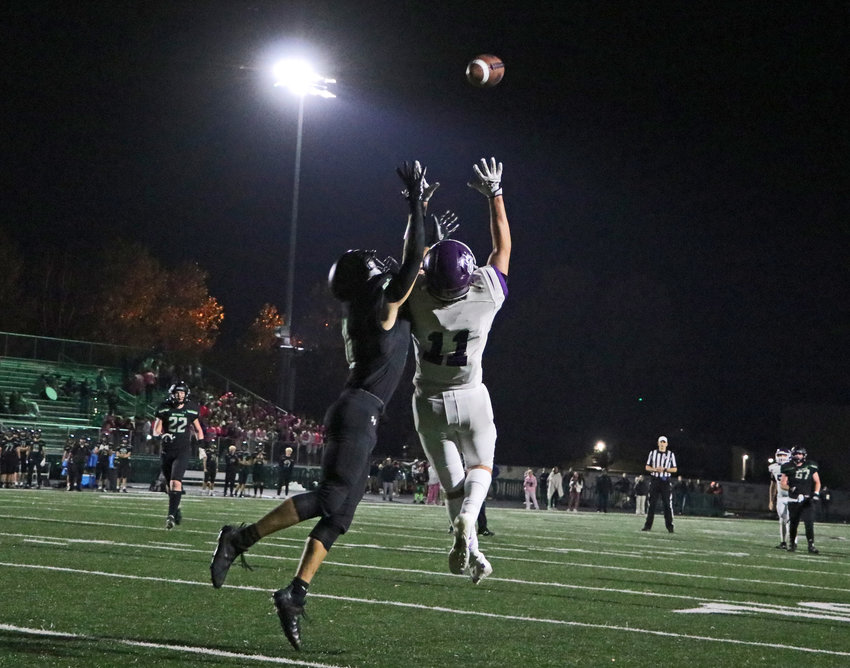 Blair junior Brady Brown (11) attempts to catch a deep pass against the Skyhawks on Friday at Omaha Skutt.