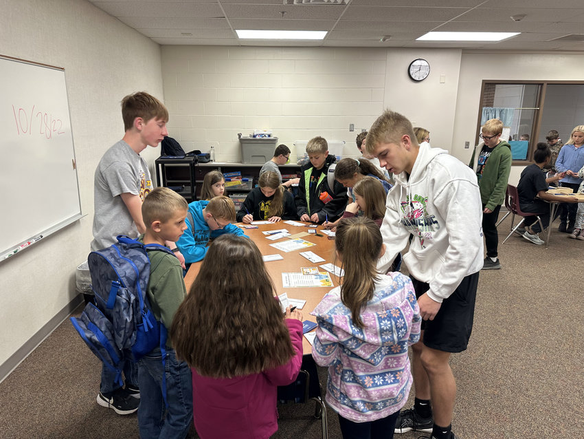 Arlington FBLA members run the Eagles Bank in School in conjunction with Two Rivers Bank. On Oct. 28, depositors lined up to earn a special spooky prize.  In all, the tellers served more than 100 elementary students who deposited more than $630.