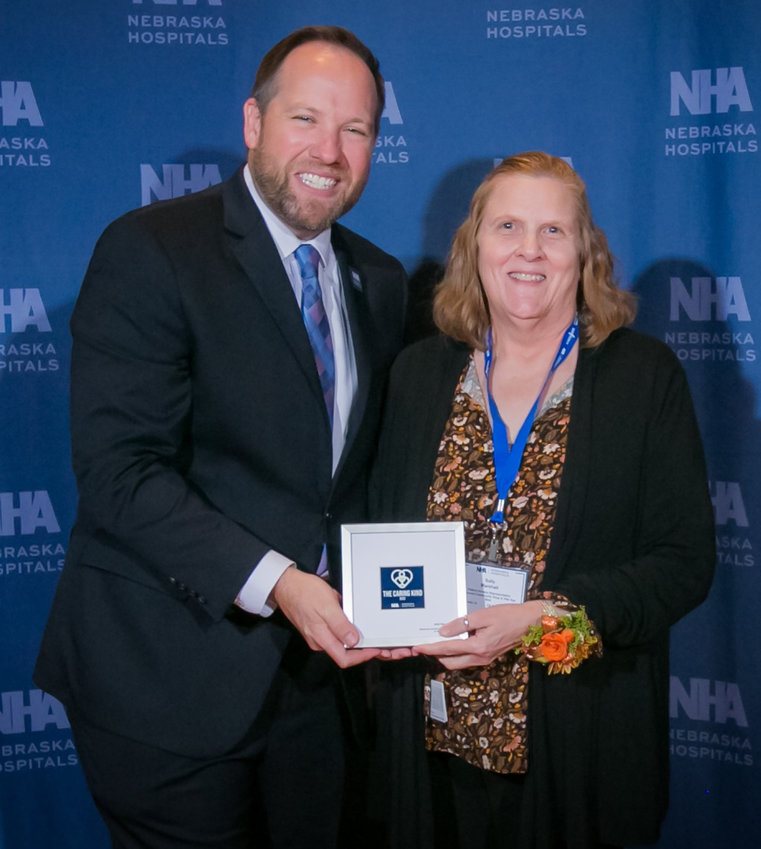 Sally Marshall, Patient Access Representative at Memorial Community Hospital and Health System, was honored with the Nebraska Hospital Association's Caring Kind Award at the NHA Annual Convention in October. She is pictured with Nebraska Hospital Association President Jeremy Nordquist.