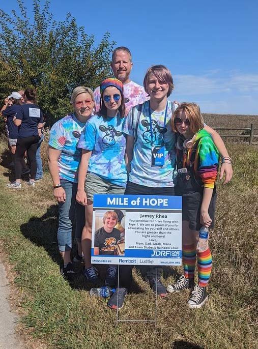 Members of &quot;Diabetic Rainbow Cows&quot; stops at the marker for Jamey Rhea, center, who has Type 1 Diabetes.