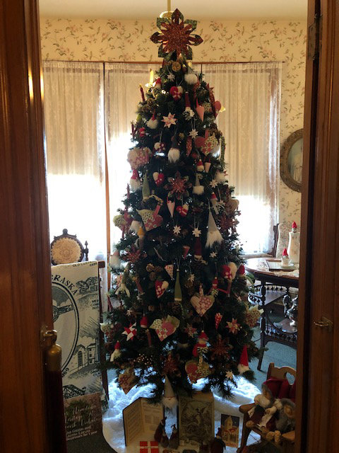 Blair natives Lisa Gustin and Lorene Larsen have decorated a tree displayed at the Beresheim House in Council Bluffs to reflect the Danish American heritage of Blair. The tree is on display as part of the annual Christmas at the Hisotric Dodge House.