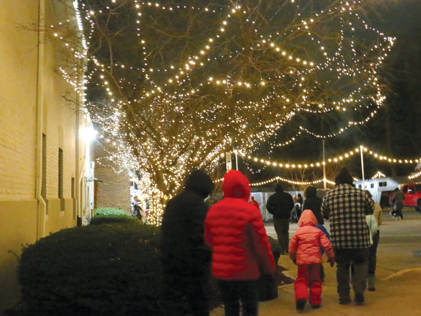 White-lit trees provided a wintery walkway to activities at the Tannenbaum.