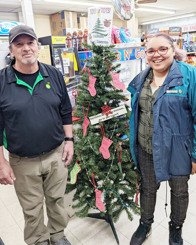 Oakland Fire and Rescue&rsquo;s Sheena Reidy and Andy&rsquo;s Quik Stop employee Joe Waller are ready for the Annual Toys for Tots Drive to begin.  Pick up your stocking at Andy&rsquo;s or Oakland Express today.