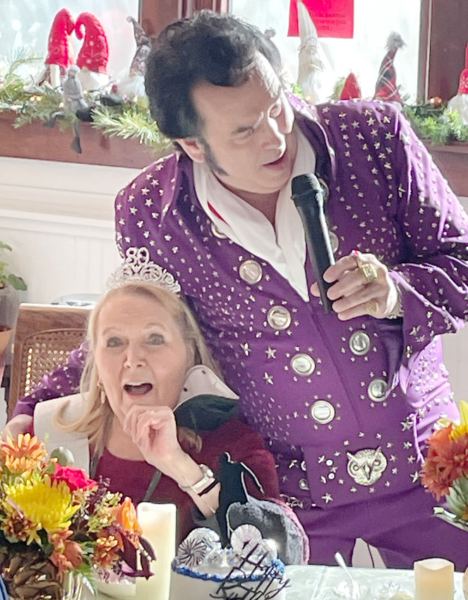 Elvis impersonator Craig Florian brought a huge smile and red cheeks on the face of Linda Murray as she celebrated her 80th Birthday.