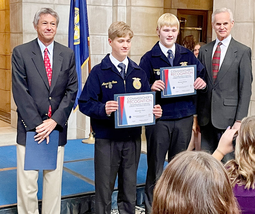 middle left) Braxton Watson and (middle right) Alexander Timm were proudly presented the awards from (Far left) Nebraska Deputy Commissioner of Education Brian Halstead and (far right) Lieutenant Governor Mike Foley.