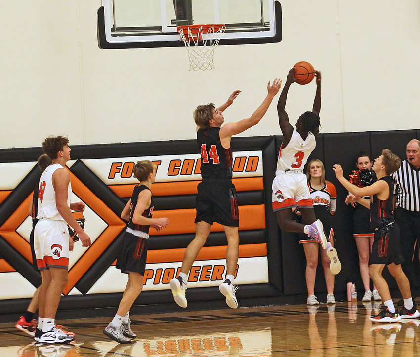 The Pioneers' Wyatt Appel, middle, leaps for the ball as an Oakland-Craig player grabs it Monday at Fort Calhoun High School.