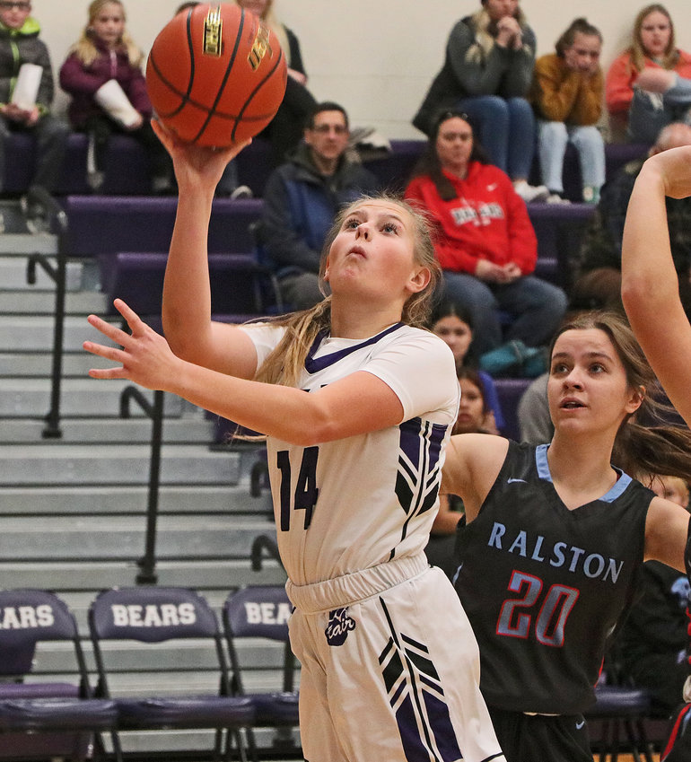 The Bears' Joslyn Policky, left, puts up a shot against Ralston on Saturday at Blair High School.