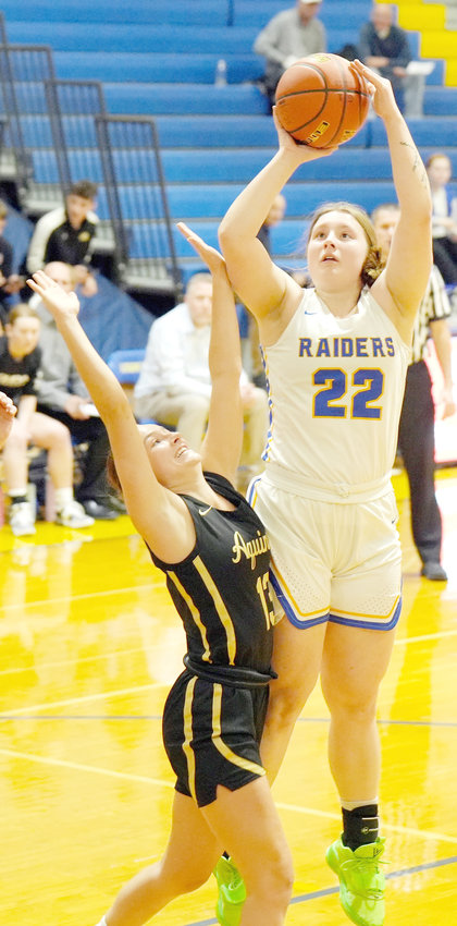 Senior Raider Sophia Vacha #22 goes up with the shot in the lane in the win over David City Aquinas.