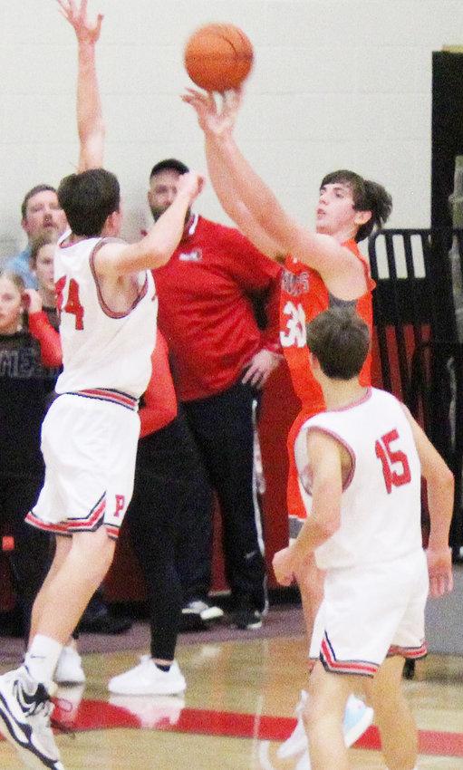 Mason Pearson puts up a shot over the Pender defender.