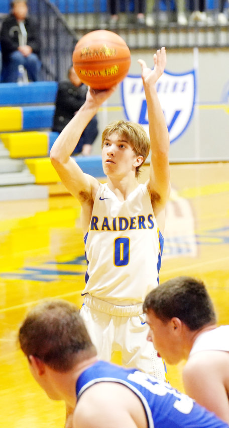 Truman Young #0 eyes the hoop and sinks the free throw in the win over Columbus Lakeview.