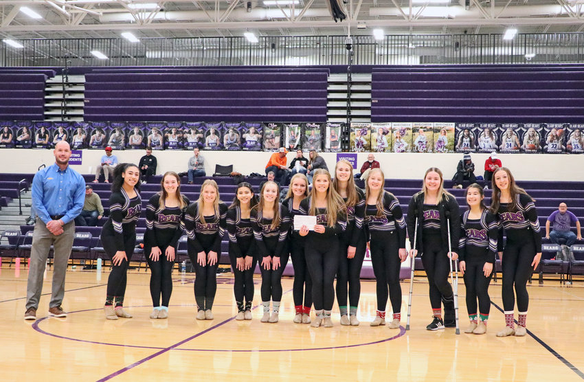 The Blair dance team poses for a photo with Jason Ferguson of Sid Dillon Chevrolet after he presented them a check for $1,500 on Dec. 20 at Blair High School.